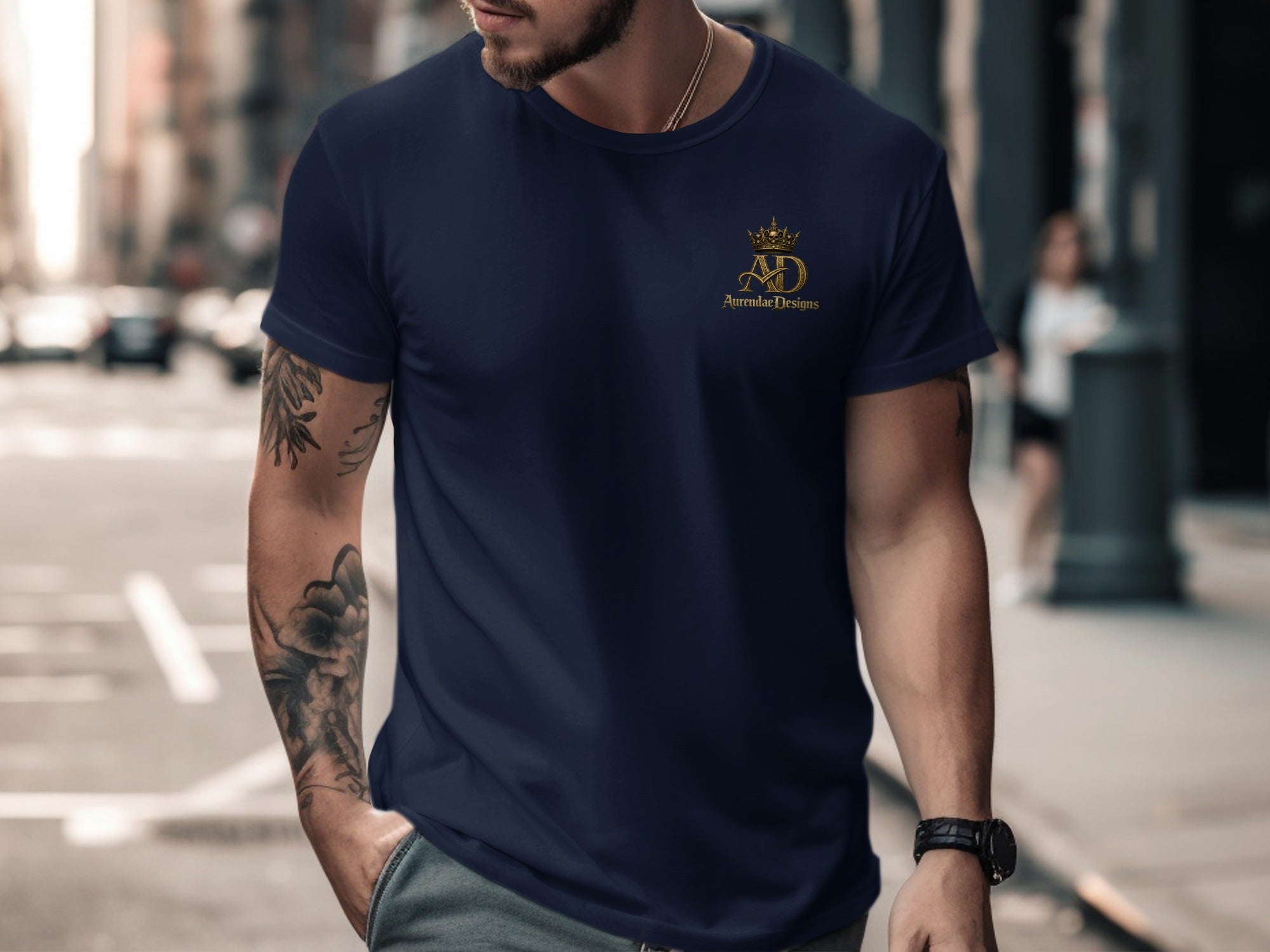 Navy t-shirt with gold crown and AD Apparel Designs logo.