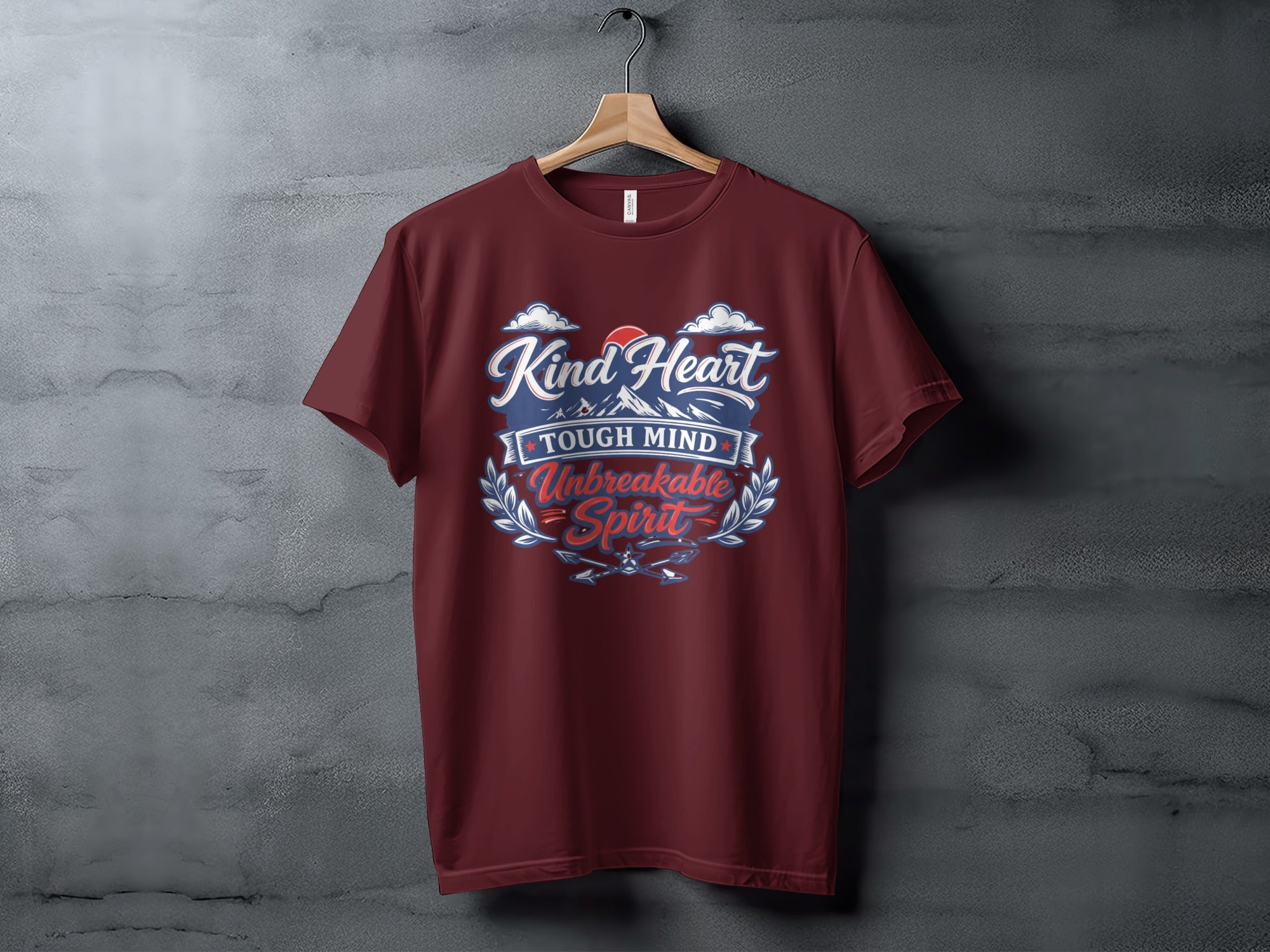 Maroon t-shirt with "Kind Heart, Tough Mind, Unbreakable Spirit" text and mountain design.