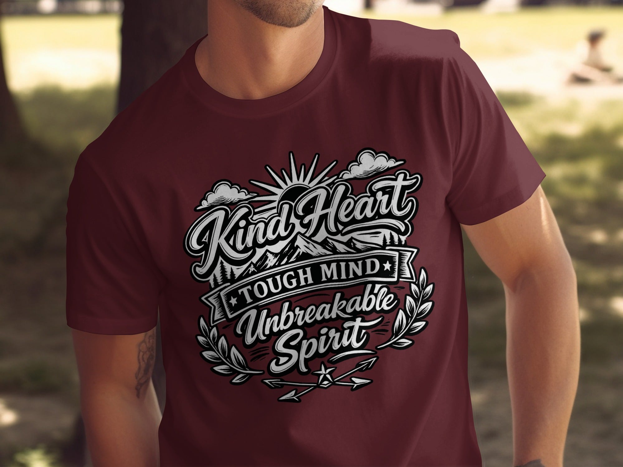 Maroon t-shirt with "Kind Heart Tough Mind Unbreakable Spirit" text design.