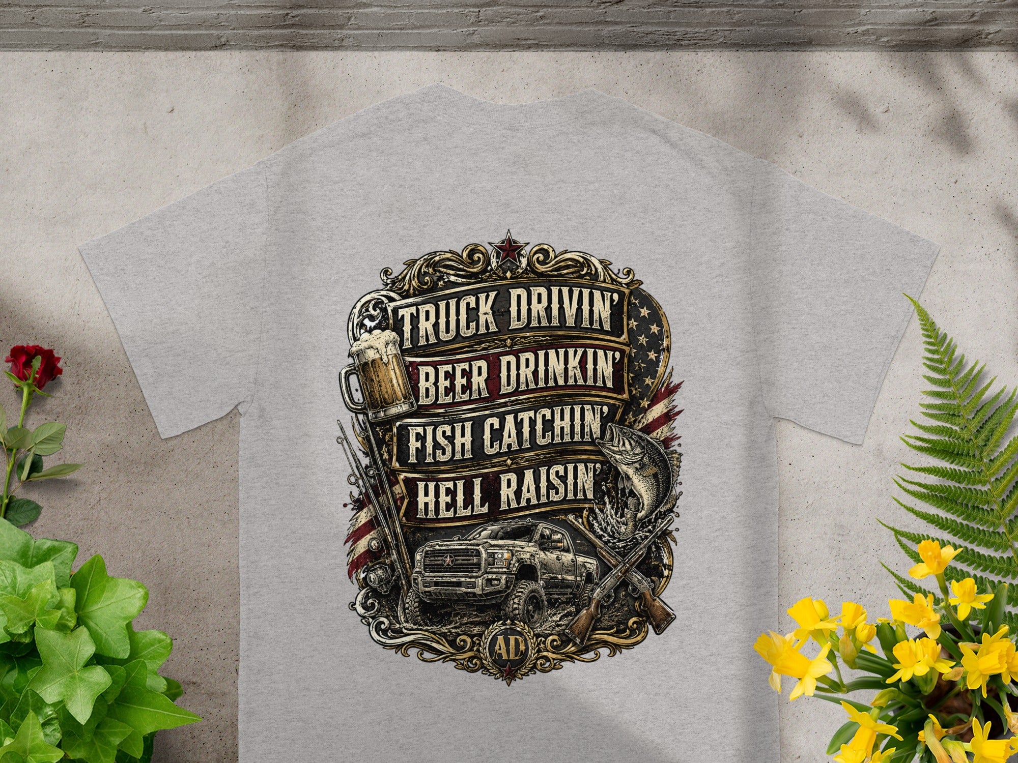 Grey t-shirt with "Truck Drivin', Beer Drinkin', Fish Catchin', Hell Raisin'" text and graphics.