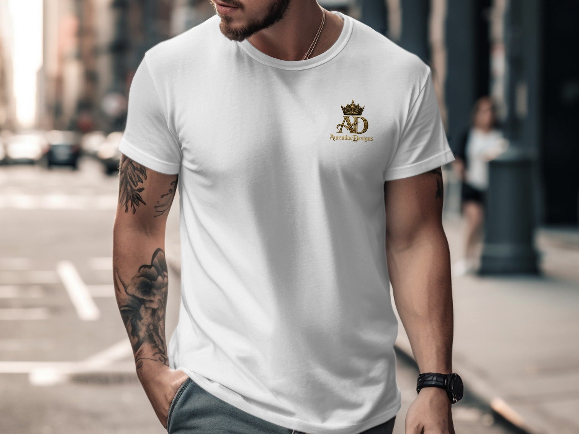 White t-shirt with gold AD crown logo on chest.