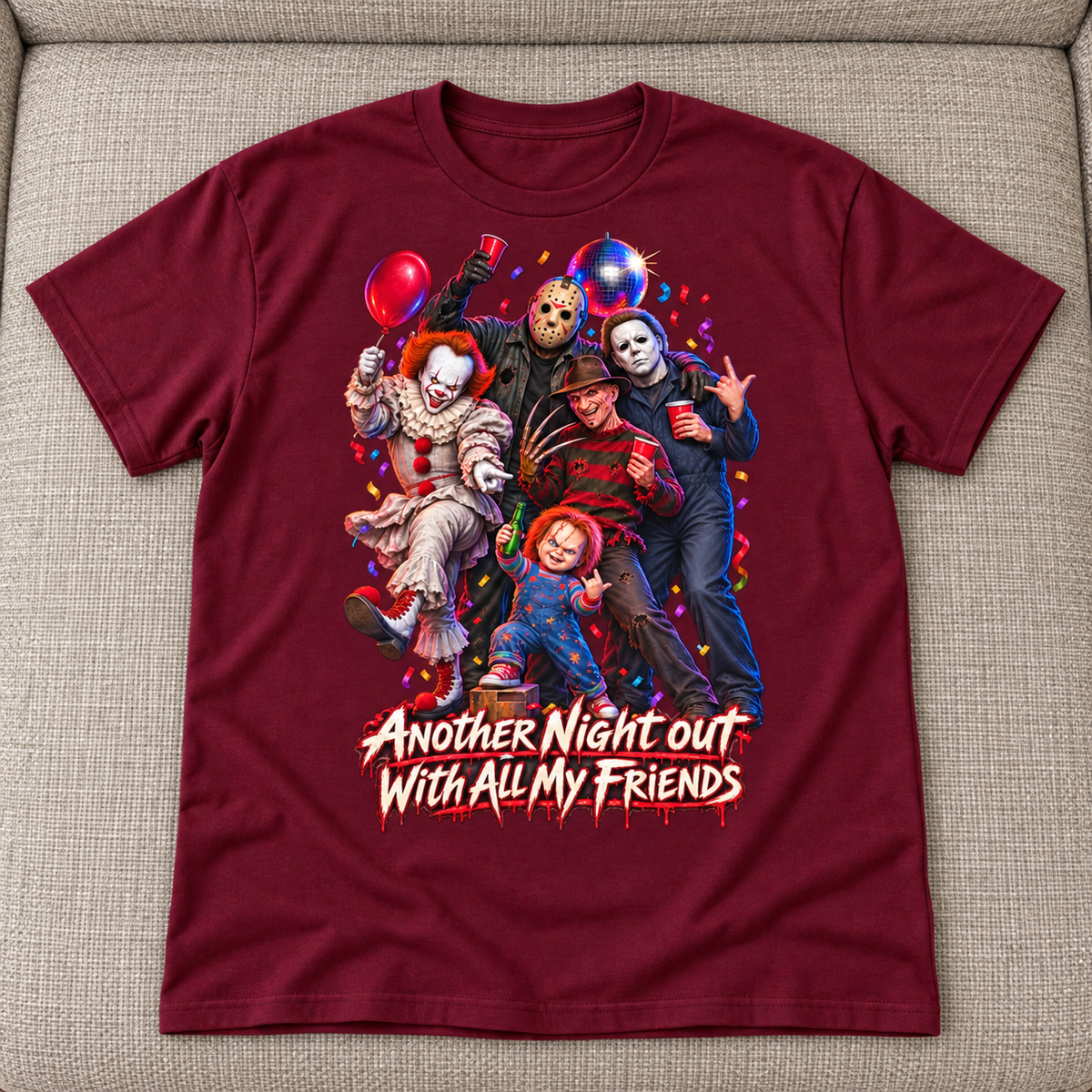 Burgundy Halloween T-shirt mockup with five horror characters partying above Another Night Out With All My Friends, laid flat on a neutral couch.