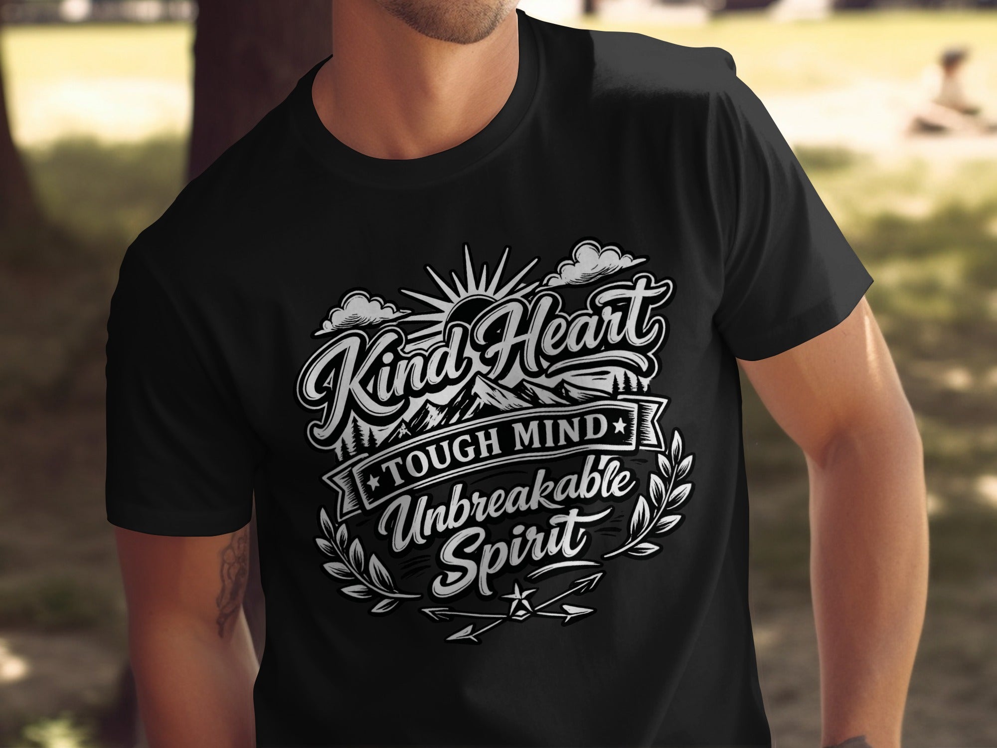 Black t-shirt with "Kind Heart Tough Mind Unbreakable Spirit" text design.