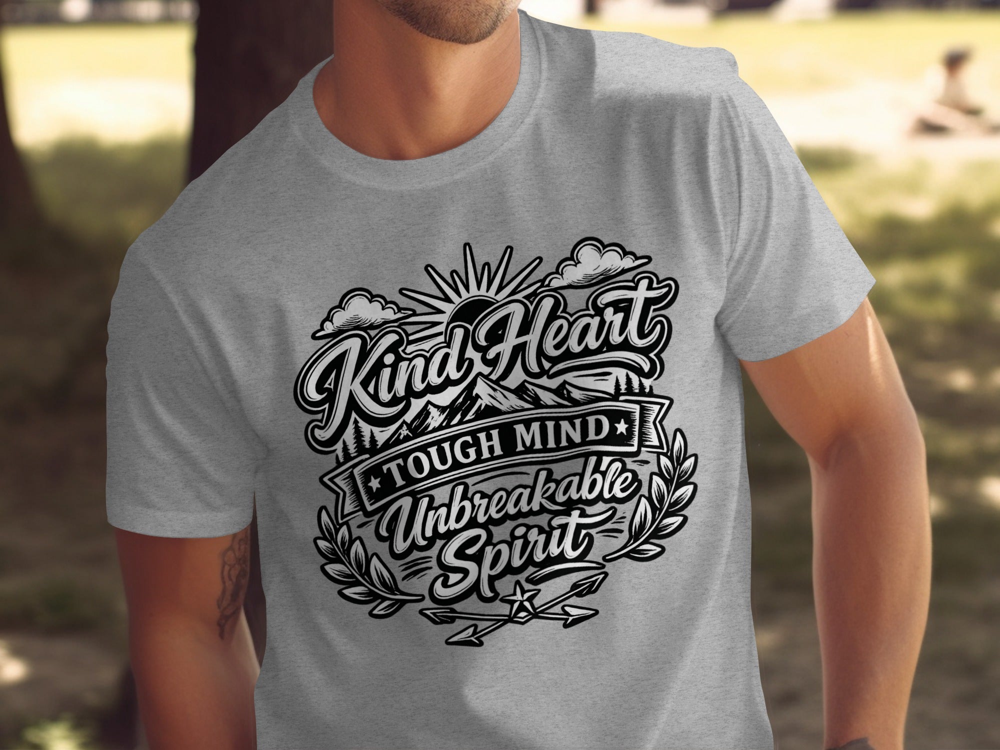 Grey t-shirt with "Kind Heart Tough Mind Unbreakable Spirit" text design.